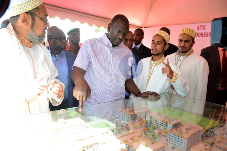 President William Ruto viewing the building plans of Nakuru's affordable housing project in Bondeni on February 13, 2023